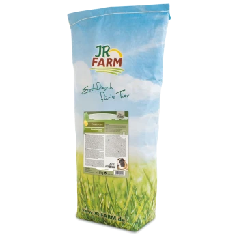 Ein 5 kg Sack JR FARM Haustierfutter, beschriftet mit 'Kornfrei', vor einem blauen Himmel und einer grasbewachsenen Kulisse. Die Vorderseite zeigt das Markenlogo und den Produktnamen.