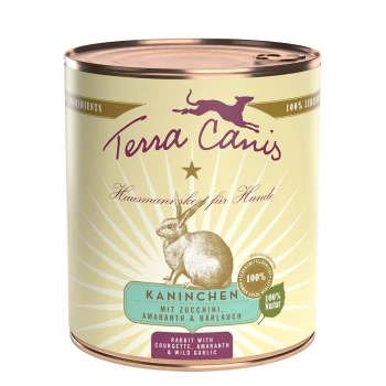 Dose mit Terra Canis Hundefutter mit Kaninchenillustration, beschriftet "Kaninchen mit Zucchini, Amaranth & Bärlauch", hebt 100% natürliche Zutaten hervor.