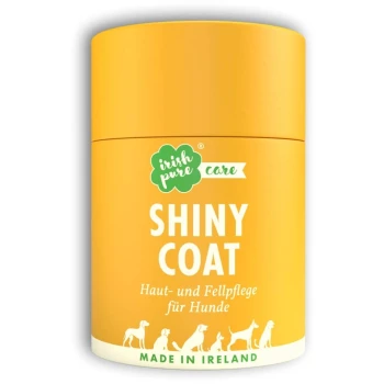 Care Shiny Coat Gelber Behälter mit der Aufschrift "SHINY COAT" für die Haut- und Fellpflege von Hunden, mit Text auf Deutsch und einer Silhouette verschiedener Hunderassen.