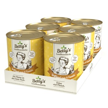 Sechs Dosen Betty's Landhausküche Haustierfutter, mit einem gelben Design, beschriftet "Geflügel & Taurin" und "Extra viel Fleisch."