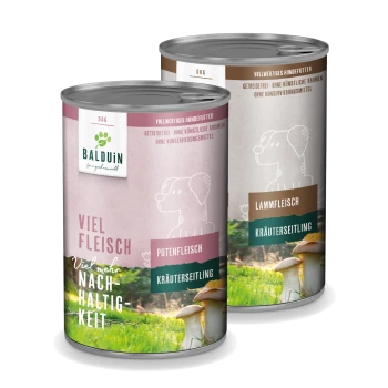 Zwei BALDUIN Hundefutterdosen: pink mit der Aufschrift "PUTENFLEISCH" (Truthahn) und braun "LAMMFLEISCH" (Lamm), beide getreidefrei und komplett.