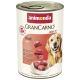 Dose Animonda GranCarno Adult 1+ Hundefutter mit Rind, zeigt Fleischstücke und einen glücklichen Golden Retriever.
