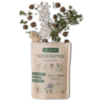 Eine Tüte mit "Hundehappen Schlafmütze" Hundeleckerlis (125g), die Kräuter und Kroketten enthält, als vegan gekennzeichnet und Entspannung für Hunde fördert.