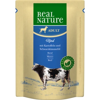 Real Nature Adult dog food package featuring beef with potatoes and black cumin oil, illustrated with a cow and a natural ingredients seal.