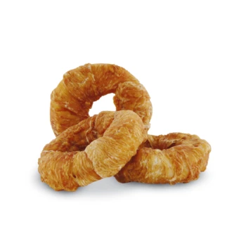 Three golden-brown, crunchy dog treats shaped like rings, stacked on a white background.