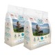 Zwei Säcke Swiss Natural Adult Mini Hundefutter, jeweils 1 kg, mit einer malerischen Kulisse und Text, der Zutaten und Vorteile hervorhebt.