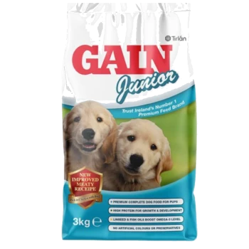 Gain Junior dog food bag featuring two golden retriever puppies, with text highlighting "NEW IMPROVED MEATY RECIPE" and nutritional benefits.