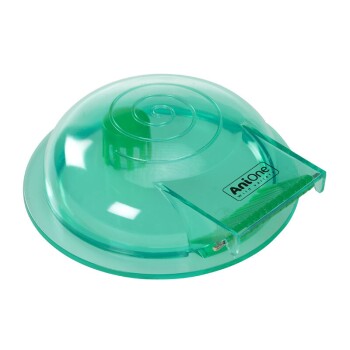 Green plastic pet feeding dish with a spiral design on top and a sliding opening, labeled "AniOne Wild & Free."