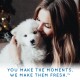 A person holds a fluffy white puppy in a cozy, softly lit setting with holiday decor. Text: "YOU MAKE THE MOMENTS. WE MAKE THEM FRESH.™"