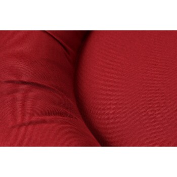 Nahaufnahme eines plüschigen roten Haustierbettes mit einer strukturierten Stoffoberfläche, das sein weiches und gemütliches Design zeigt.