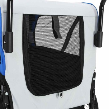 Ecke eines Haustierwagens mit einem Netzfenster zur Belüftung, mit einem grauen und blauen Stoffdesign und einem Reißverschlussöffnung.