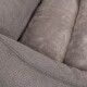 Nahaufnahme eines weichen, grauen Haustierbettes mit strukturiertem Stoff und plüschiger Polsterung, ideal für den Komfort von Haustieren.