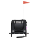 Schwarze Haustiertragetasche mit einem Netzfront, reflektierenden Streifen und einer roten Flagge oben, konzipiert für den sicheren Transport von Haustieren.