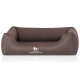 Braunes Hundebett mit erhöhten Seiten und einem weißen "KNUFFELWUFF"-Logo auf der Vorderseite, entworfen für Komfort und Stil.