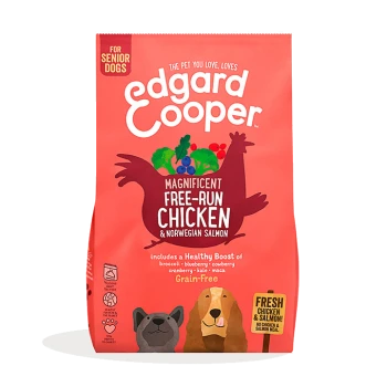 Dog food bag from Edgard Cooper for senior dogs, labeled "Magnificent Free-Run Chicken & Norwegian Salmon," grain-free with fruit illustrations.