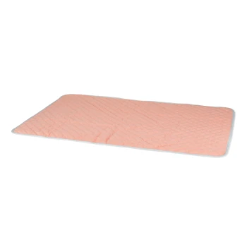A soft, quilted pet mat in a light peach color with a white border, designed for pet comfort and relaxation.