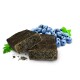 Two dark, rectangular pet treats are displayed with fresh blueberries and green leaves in the background.