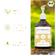 Ein Hund steht auf grünem Gras neben einer Flasche mit einem Haustier-Nahrungsergänzungsmittel, das "BIO BIERHÄNDE" beschriftet ist und gesunde Haut, Darmbakterien und Verdauung fördert.