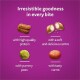 Pet food image showcasing four treats: high-protein, soft center, pea, and carrot, on a purple background with "Irresistible goodness in every bite."