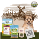BELLEFOR Haustierprodukte: Hundefutterbeutel, "LANDGUT-HAPPEN" Leckerlis, "SHIMUN IMMUN" Ergänzungsmittel und eine Tragetasche mit "HUNDE LIEB HABER." Ländlicher Hintergrund.