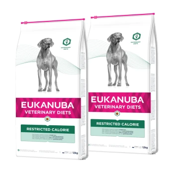 Torby z karmą dla psów Eukanuba Veterinary Diets, oznaczone jako "Restricted Calorie," z sylwetką psa, 12 kg każda.