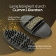 Zwei schwarze Gummi‑Pferdebürsten mit Riemen und Noppen; sichtbarer Text: „Langlebigkeit durch Gummi‑Borsten“