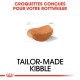Croquettes sur mesure pour Rottweilers, présentant un morceau de croquette marron avec un contour de croquis, et un texte en français et en anglais.