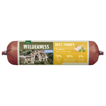 Wilderness Junior pet food packaging featuring two wolf pups, highlighting "Best Turkey" with 70% turkey, 30% plants, and 0% grains.