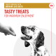 A hand offers a treat to a happy spotted dog. Text: "Urinary S/O diet compatible" and "Tasty treats for enjoyment."