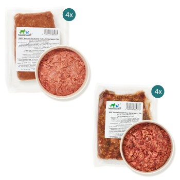 Zwei Pakete Haustierfutter, beschriftet mit "BARF Komfort PLUS CAT" in Huhn- und Rindfleischgeschmack, mit einer Schüssel jeder Sorte angezeigt.