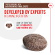 Dog treat designed for gastrointestinal diets, featuring low fat, prebiotics, and vitamin B12, with text highlighting expert development.