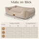 Hundebett mit einer weichen beigen Textur, mit den Abmessungen A, B, C, D und einer Größentabelle für M, L, XXL. Text auf Deutsch.