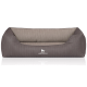 Graues Hundebett mit geripptem Design und weichem Innenraum, mit dem Logo "KNUFFELWUFFF" auf der Vorderseite.