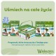 Zestaw psich przysmaków dentystycznych Whimzees w zielonym opakowaniu i wiaderku, widoczny polski slogan „Uśmiech na całe życie”