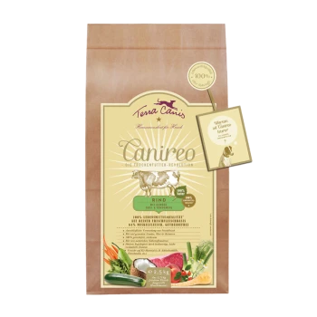 Braune Papiertüte mit Terra Canis Trockenfutter für Hunde, gekennzeichnet mit "Canireo" und einer Kuhillustration, mit den Texten "Rind" und "100% Natur".