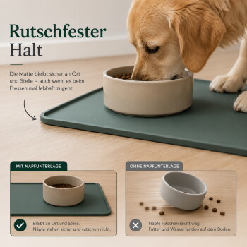Draufsicht auf einen braunen Hund, der aus einem Edelstahlnapf auf einer grünen Matte trinkt, mit spritzendem Wasser und Futterstücken.