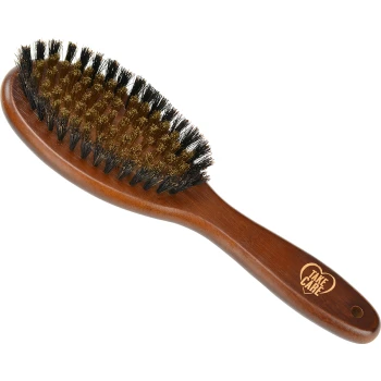 A wooden pet grooming brush with a curved handle, featuring a mix of bristles and pins, engraved with "TAKE CARE" in a heart.