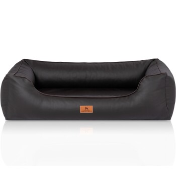 Ein plüschiges, dunkelbraunes Hundebett mit erhöhten Seiten und einer lederähnlichen Textur, mit einem kleinen 'KNUFFELWUFFS'-Logo auf der Vorderseite.