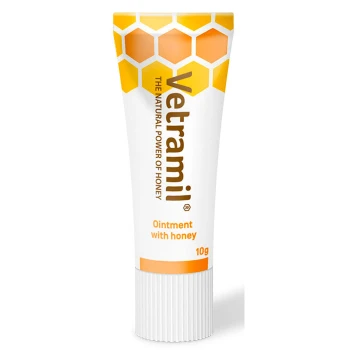 Sårsalve med medicinsk honning 10 g Vetramil Salbe mit Honig, 10g Tube, mit einem Waben-Design und dem Text "DIE NATÜRLICHE KRAFT DES HONIGS."