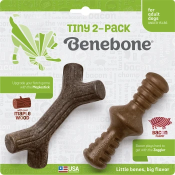Two dog chew toys from Benebone, labeled "Tiny 2-Pack," featuring a Maplestick and Zaggler, with bacon flavor and real maple wood.