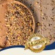 Eine Holzschale mit gemischten Samen und Körnern, die ein goldenes Abzeichen trägt, das "Beste Qualität" und "10 Jahre" für zehn Jahre Qualität liest.
