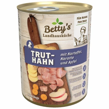 Dosenfutter für Hunde mit der Bezeichnung "Betty's Landhausküche TRUTH-HAN" mit Truthahn, Kartoffeln, Karotten und Äpfeln, vor einem Holz-Hintergrund.