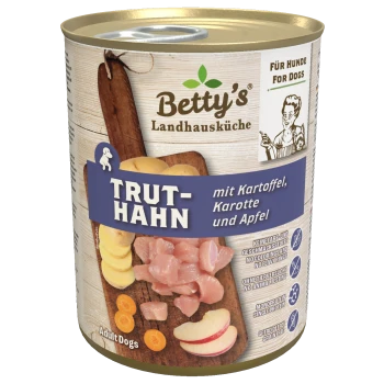 Dosenfutter für Hunde mit der Bezeichnung "Betty's Landhausküche TRUTH-HAN" mit Truthahn, Kartoffeln, Karotten und Äpfeln, vor einem Holz-Hintergrund.