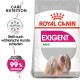 Royal Canin Exigent Mini Hundefutterbeutel mit einer Illustration eines kleinen Hundes, mit Text, der Pflegeernährung und Zufriedenheit mit Vorlieben hervorhebt.