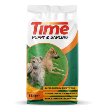 15kg bag of "Time Puppy & Sapling" puppy food, featuring playful greyhounds and highlighting bone strength for greyhounds and whippets.