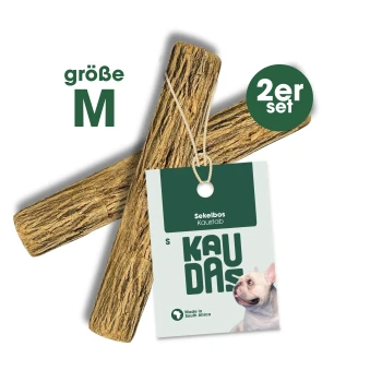 Zwei Kauknochen mit der Bezeichnung "Sekelbos Kaustab" in Größe M, mit einem Etikett, das "2er Set" und ein Hundebild zeigt, hergestellt in Südafrika.