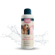 Flasche 'nimo' sensibles Hundeshampoo mit einem Hundebild, mit Wasserspritzern im Hintergrund.