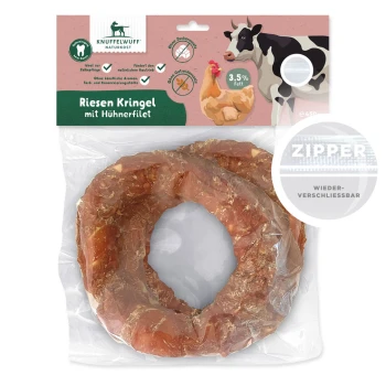 Riesen Kringel Hundeleckerli mit Hähnchenfilet, 3,5% Fett, in einem wiederverschließbaren Beutel, mit einer Illustration von einer Kuh und einem Huhn.