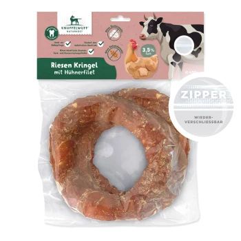 Riesen Kringel Hundeleckerli mit Hähnchenfilet, 3,5% Fett, in einem wiederverschließbaren Beutel, mit einer Illustration von einer Kuh und einem Huhn.
