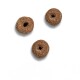 Three round, brown pet food pellets with a hole in the center, displayed against a white background.
